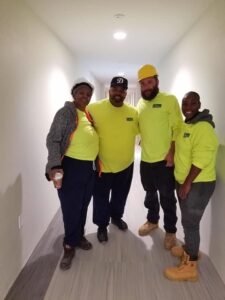Licensed and bonded cleaning business crew in branded uniforms